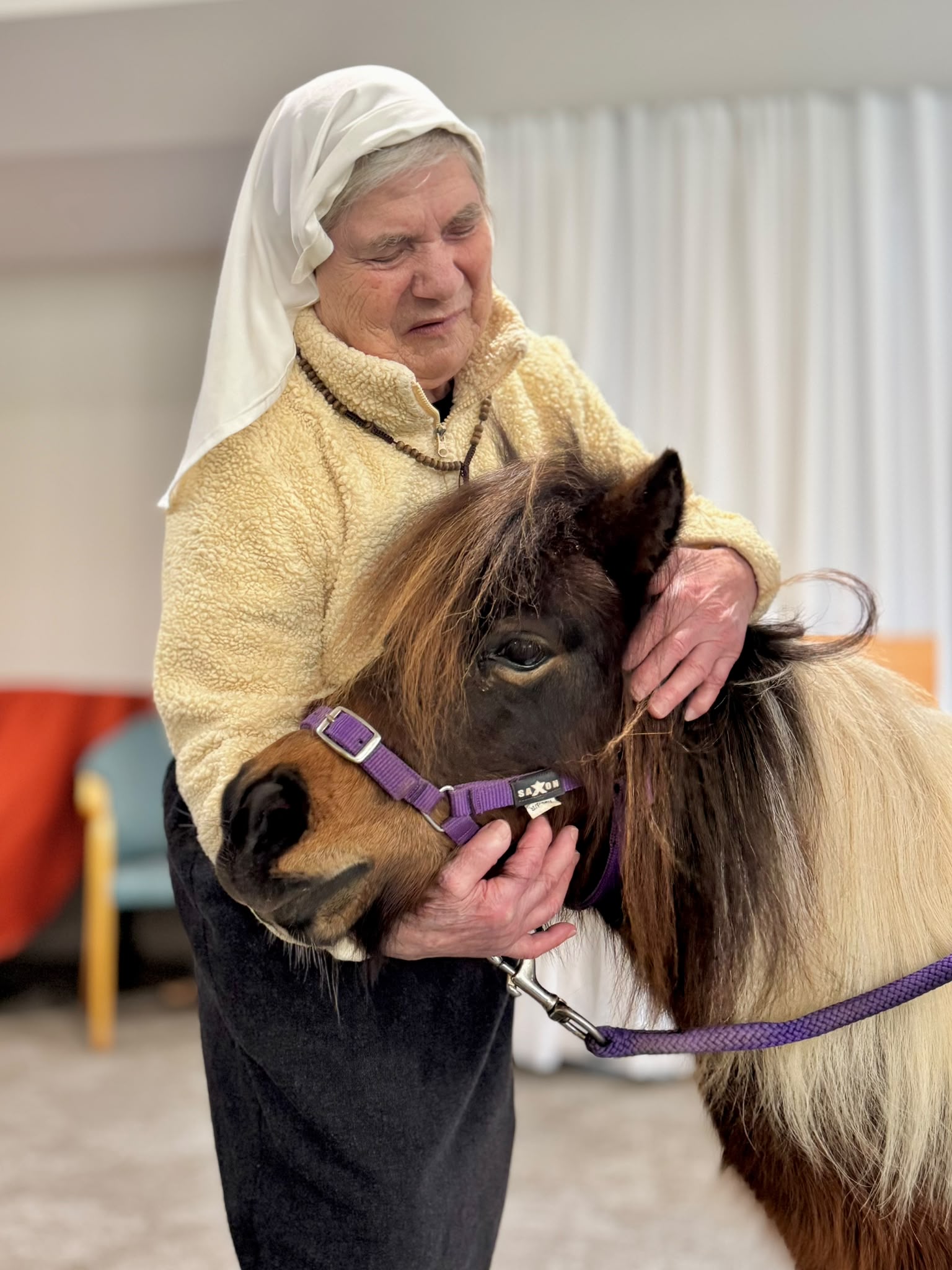 A resident connecting with Peanut during a supervised visit